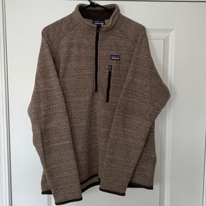 Brown Patagonia quarter zip fleece with front zip pocket